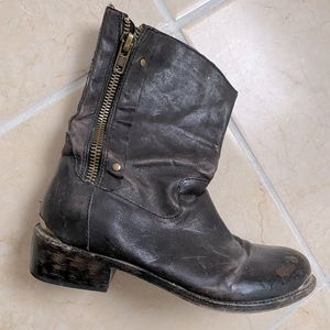 Distressed boot metal detail